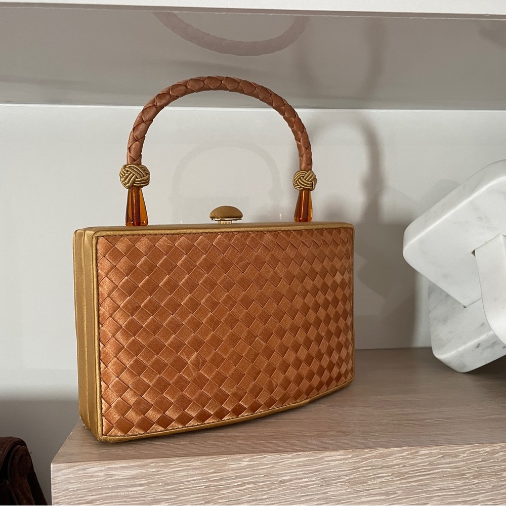 Yellow Satin Intrecciato Weave
Gold-Tone Hardware Braided Handle Satin Lining